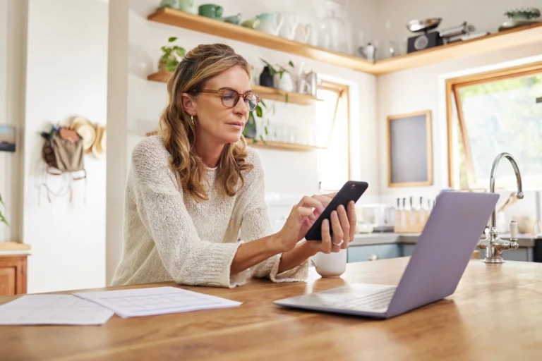 homeowner researches how to determine how old her roof is