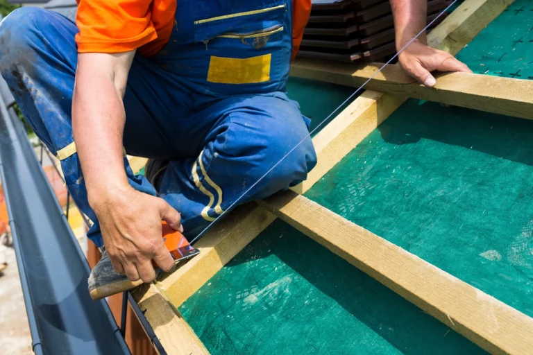 roofer measuring the roof for better accuracy