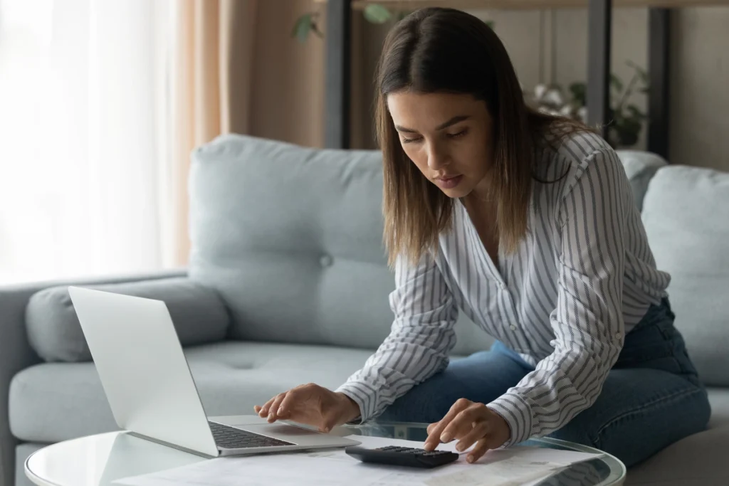woman using calculator