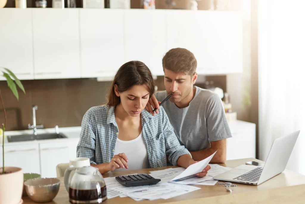 couple planning roof repair cost