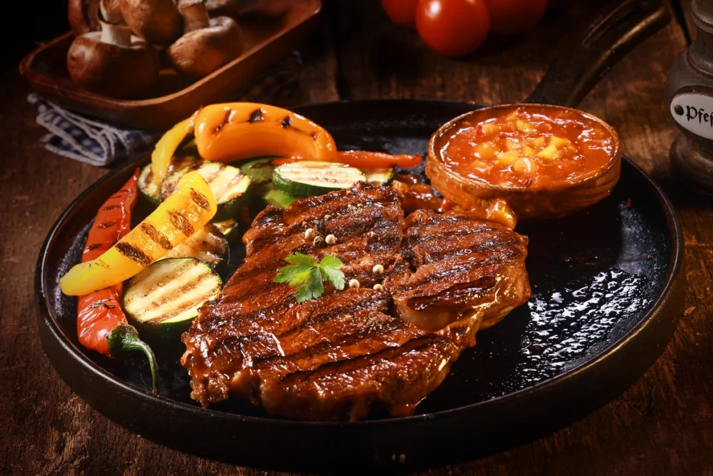 steak and veggies in dish