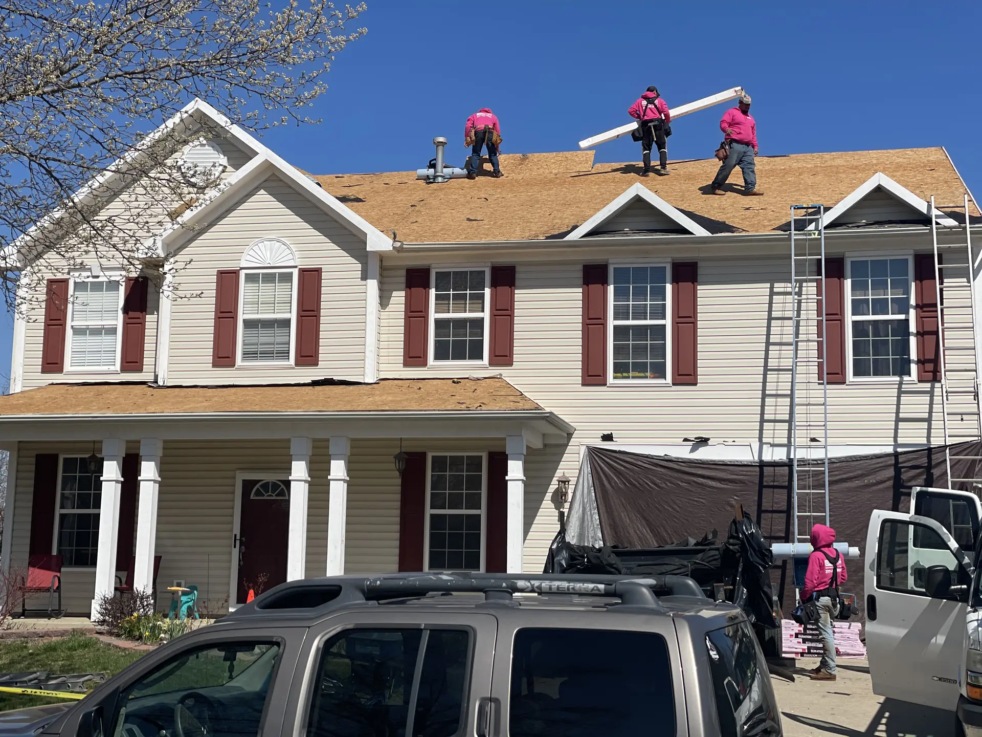 contractors repairing roof